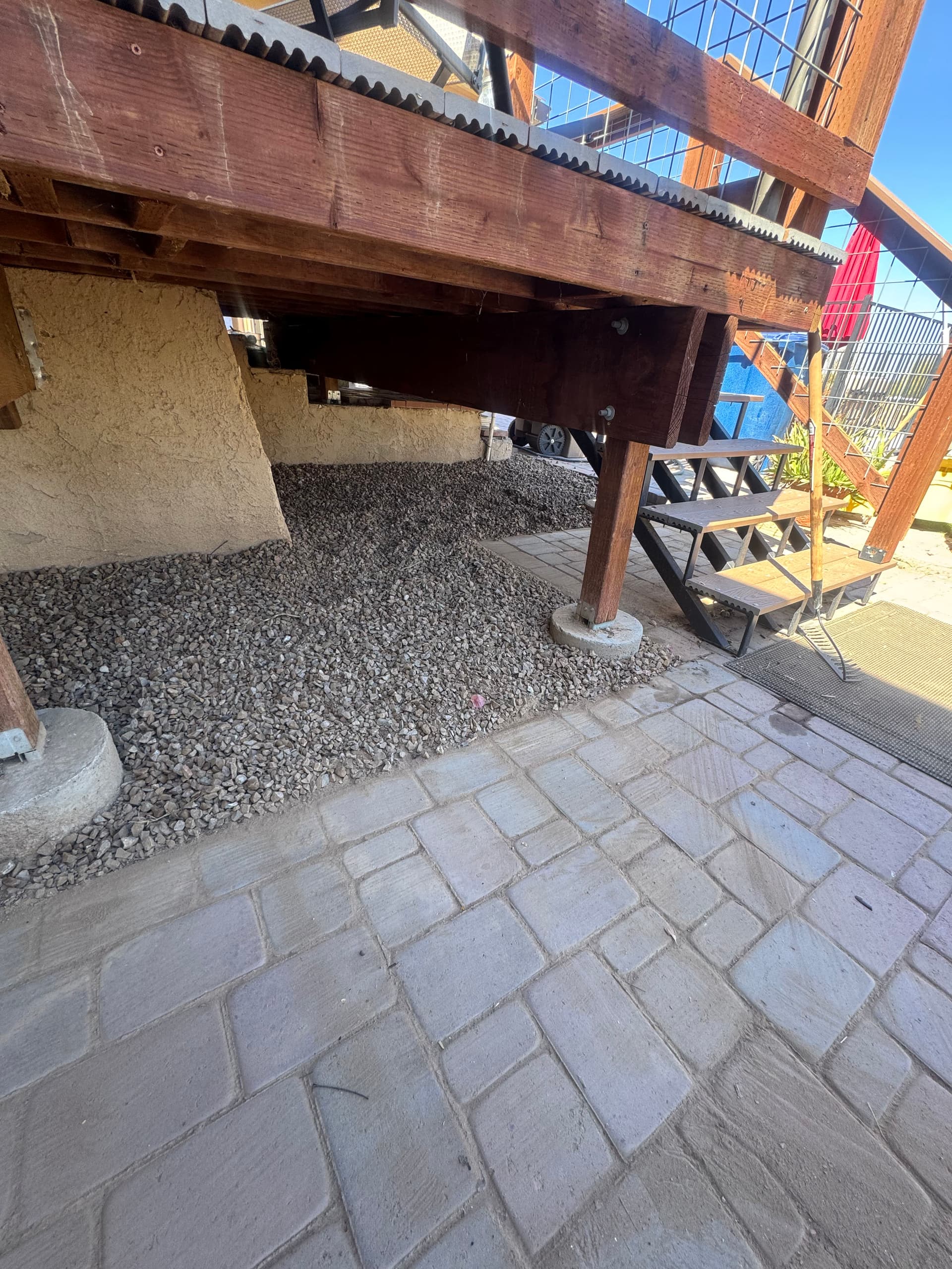 Rock Installation Under Deck